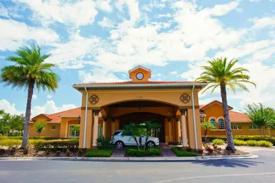 a house with a car parked in a driveway at Disney Getaway Private Pool Game Room. Book Now BV77 in Kissimmee