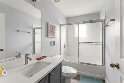a bathroom with a sink and a toilet and a shower at Disney Getaway Private Pool Themed Bedrooms. Book Now EIR67 in Kissimmee