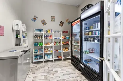 a room with a refrigerator with food in it at Disney Getaway Private Pool Themed Bedrooms. Book Now EIR67 in Kissimmee