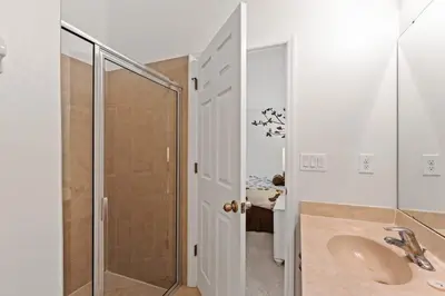 a bathroom with a sink and a shower at Disney Getaway Luxury Villa with Private Pool Game Room. Book Now VP48 in Kissimmee