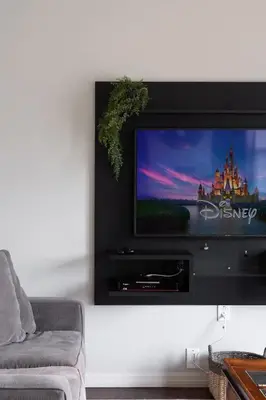 a flat screen tv hanging on a wall at Disney Getaway Private Pool Themed Bedrooms. Book Now WLV83 in Kissimmee