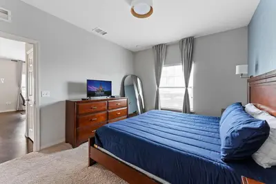 a bedroom with a bed and a dresser and a television at Disney Getaway Private Pool Themed Bedrooms. Book Now WLV83 in Kissimmee
