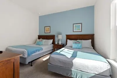 a bedroom with two beds with blue and white at Disney Getaway Private Pool Themed Bedrooms. Book Now WLV19 in Kissimmee