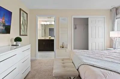 a bedroom with a bed and a bathroom at Disney Getaway Private Pool Themed Bedrooms. Book Now SLR506 in Kissimmee