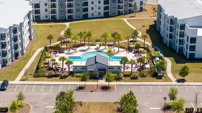 an aerial view of an apartment complex with a pool at Disney Getaway Luxury Condo with Private Balcony. Book Now SLR507 in Kissimmee