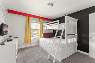 a bedroom with a white bunk bed and a desk at Disney Getaway Villa with Private Pool Hot Tub. Book Now SLR502 in Kissimmee