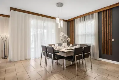 a dining room with a table and chairs at Disney Private Pool Hot Tub Themed Bedrooms. Book Now SLR494 in Kissimmee