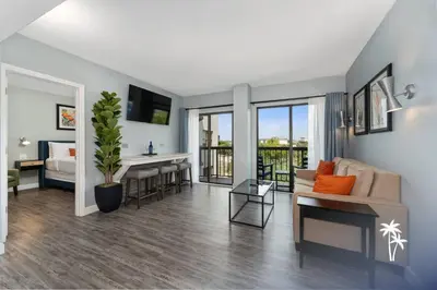 a living room with a couch and a table at Volcano View 2 Bed 2 Bath Condo with Balcony in Orlando