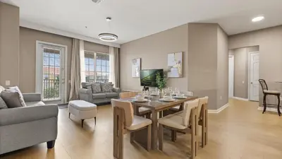a living room with a table and a couch at Near Universal's Epic Universe Suite -3BR in Orlando