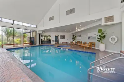 a large swimming pool in a house at Lake View Top Floor 2 Bed 2 Bath Condo with Balcony in Orlando