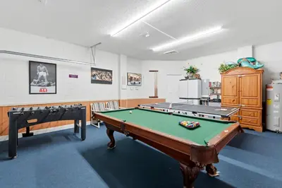 a billiard room with a pool table in it at Near Disney Pool Hot Tub Stunning Water View in Kissimmee