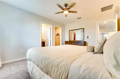 a bedroom with a bed and a ceiling fan at Pool Access Family Gem with Views in St Cloud! in Saint Cloud