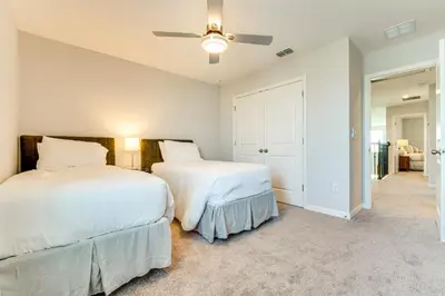 a bedroom with two beds and a ceiling fan at Pool Access Family Gem with Views in St Cloud! in Saint Cloud