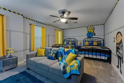 a living room with two twin beds and a couch at NEW 9Bdrm S. Facing Pool on Preserve near Dis/Univ in Kissimmee
