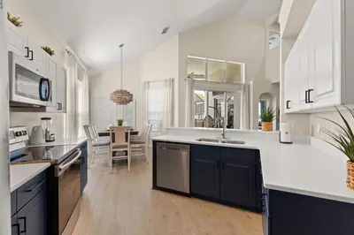 a kitchen with a sink and a counter top at Tiki Palms Play and Pool Near Disney in Kissimmee