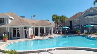 a large swimming pool in front of a building at Two bed condo in Parkway Palms Resort in Orlando
