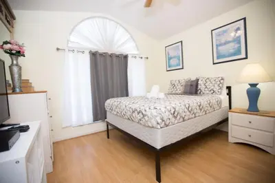 a bedroom with a bed and a window at Indian Creek Vacation Home Close to Disney in Orlando