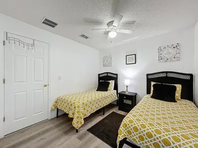 a bedroom with two beds and a ceiling fan at Terra Verde Resort 4 Bed Pool/Spa Villa in Kissimmee