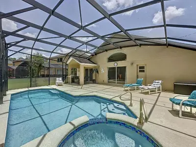 a large swimming pool with a glass roof at Terra Verde Resort 4 Bed Pool/Spa Villa in Kissimmee
