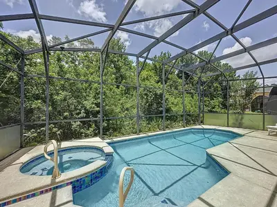 an indoor swimming pool with a glass roof at Terra Verde Resort 4 Bed Pool/Spa Villa in Kissimmee
