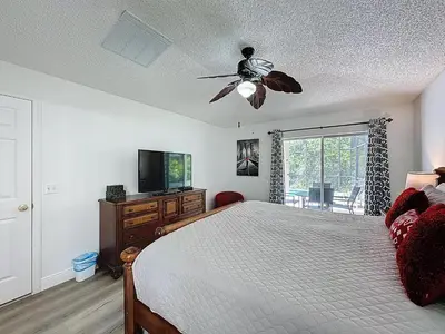 a bedroom with a bed and a ceiling fan at Terra Verde Resort 4 Bed Pool/Spa Villa in Kissimmee