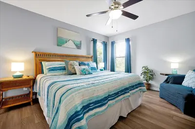 a bedroom with a bed and a ceiling fan at Emerald Island Resort 6 Bed Pool & Spa in Kissimmee