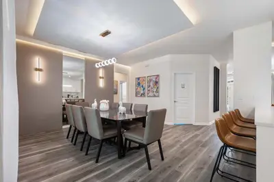 a dining room with a table and chairs at 2540HS 6Bedrooms Disney Villa Sleeps 20 with Pool & Spa in Orlando