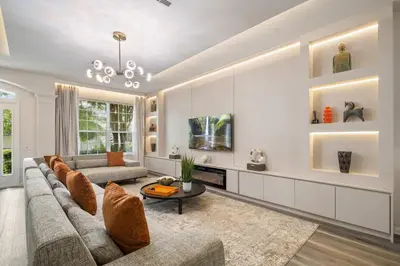 a living room with a couch and a table at 2540HS 6Bedrooms Disney Villa Sleeps 20 with Pool & Spa in Orlando