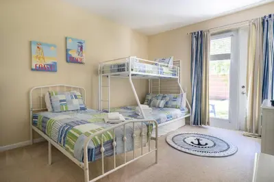 a bedroom with a bunk bed and a window at Vista Cay Townhome Near Universal & Disney in Orlando