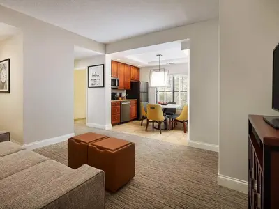 a living room with a couch and a dining room at Sheraton Vistana Villages 1BR Apartment with Resort Access in Orlando