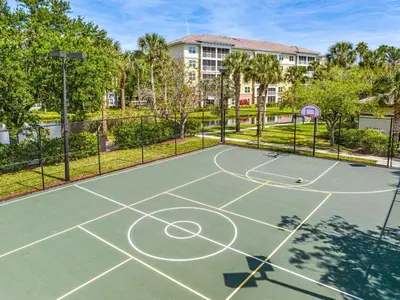 a tennis court with a basketball hoop at Sheraton Vistana Villages 1BR Apartment with Resort Access in Orlando