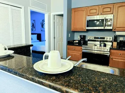 a kitchen with a counter top with a plate on it at Resort Lake Buena Vista - 2 Quartos in Orlando