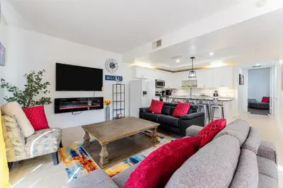 a living room with a couch and a table at Royal Homes in Kissimmee