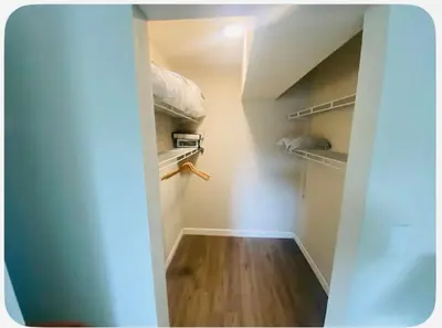 an open door to a walk in closet with wood floors at Entire 5 Bedroom Home in Winter Park FL in Orlando