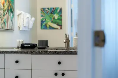 a kitchen with a counter top with a sink at Magical Stay Near Disney I Pool and Resort Access in Kissimmee