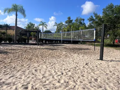 a volleyball net in the sand on a beach at Toy Story Getaway Retreat in Kissimmee
