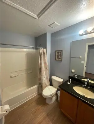 a bathroom with a toilet and a sink and a shower at Casa Bella Vida Resort Kissimmee in Kissimmee