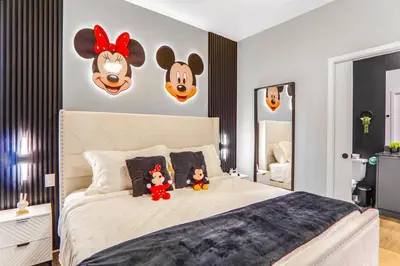 a bedroom with a bed with two stuffed animals on it at 3 Bedroom 8 Miles from Disney Word in Kissimmee