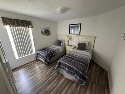 a bedroom with two beds and a window at Ortega Villa home in Kissimmee