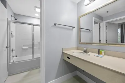 a bathroom with a sink and a mirror at Orlando 2BR Apt Full Kitchen Epic Universe in Orlando