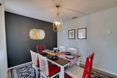 a dining room with a table and chairs at 5 Mi to WDW Resort-Style Condo with Pool Access in Kissimmee