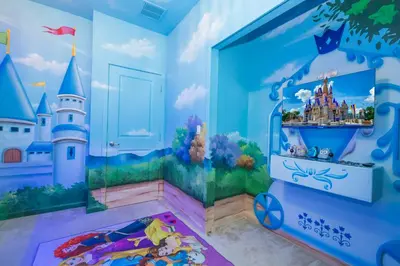 a childs bedroom with a disney castle mural at 12BR Home w Game Room Movie Theater in Kissimmee