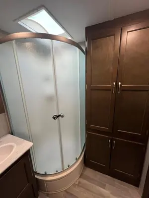 a bathroom with a shower and a sink at Beautiful RV 15 Min to Downtown Orlando in Orlando