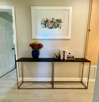 a table with a vase of flowers on top of it at Chic & Stylish 3BR-2BA Nature Lovers Home in Orlando