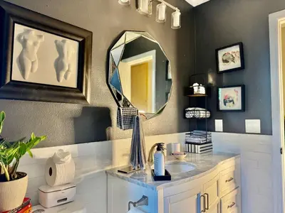 a bathroom with a sink and a mirror at Chic & Stylish 3BR-2BA Nature Lovers Home in Orlando