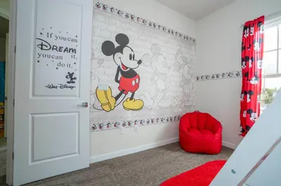 a room with a mickey mouse mural on the wall at New Vacay Home 5BD 5BA - 5 miles to Disney in Orlando