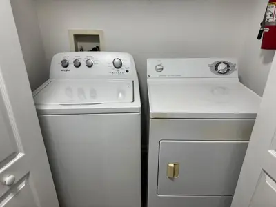 a small kitchen with a stove and a refrigerator at Bellavue Getaway in Kissimmee