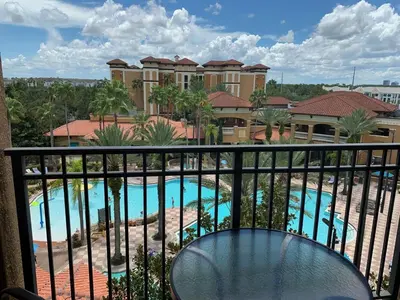 a view of the pool from the balcony of a resort at Near Orlando Convention center and all Park's in Orlando