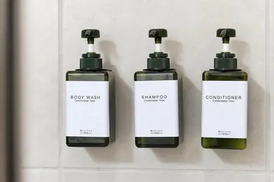 a group of three bottles of soap on a wall at Family Escape | Moana Vibes | Pool + Games in Orlando