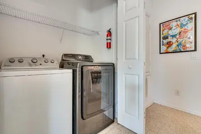 a kitchen with a stove and a stove top oven at 10 Mi to Disney World Townhome with Community Pool! in Kissimmee